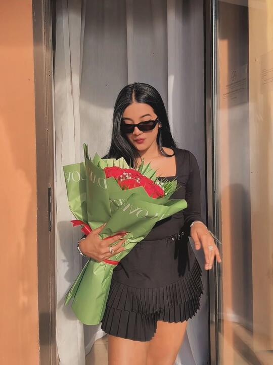 Carrying a wrapped bouquet