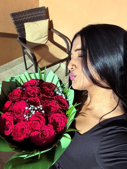 A moment with a bunch of red roses
