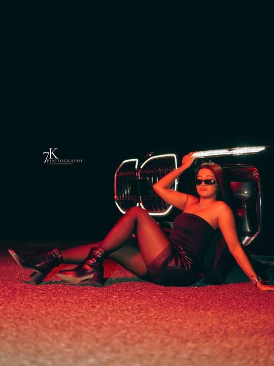Reclined by the grille under red light