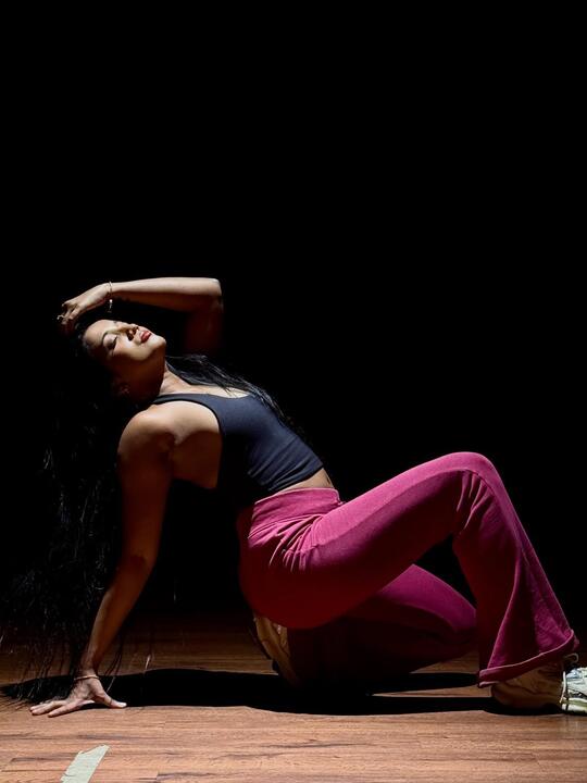 A held floor position under a single light