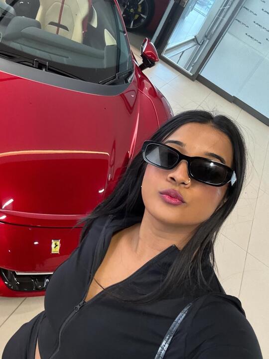Alongside a red sports car