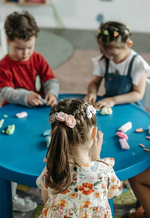 Children working at a craft table together