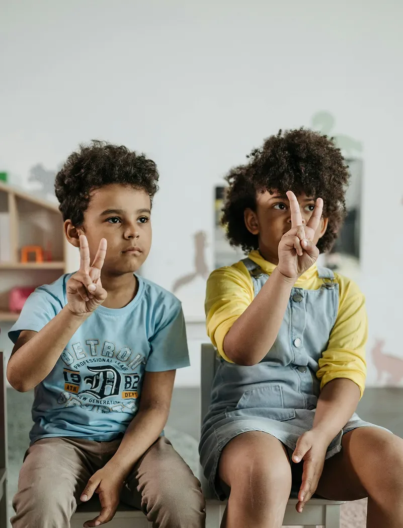 Two children sitting together and playing