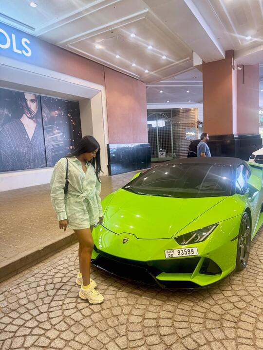 Walking past the green supercar