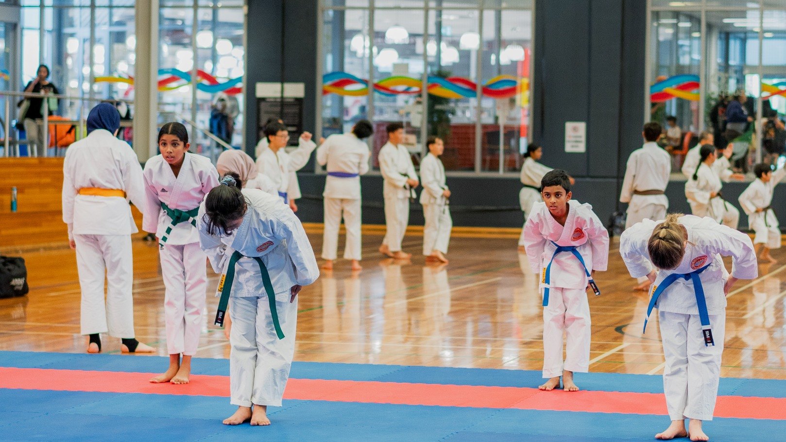 A WSKF Australia class on the mats, students bowing at the start of training